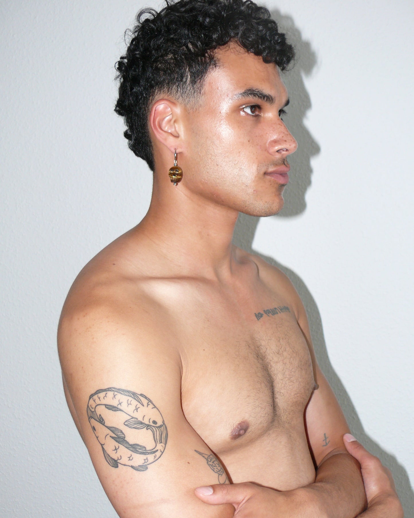 Brown agate skull pendant single earring portrait on model 1