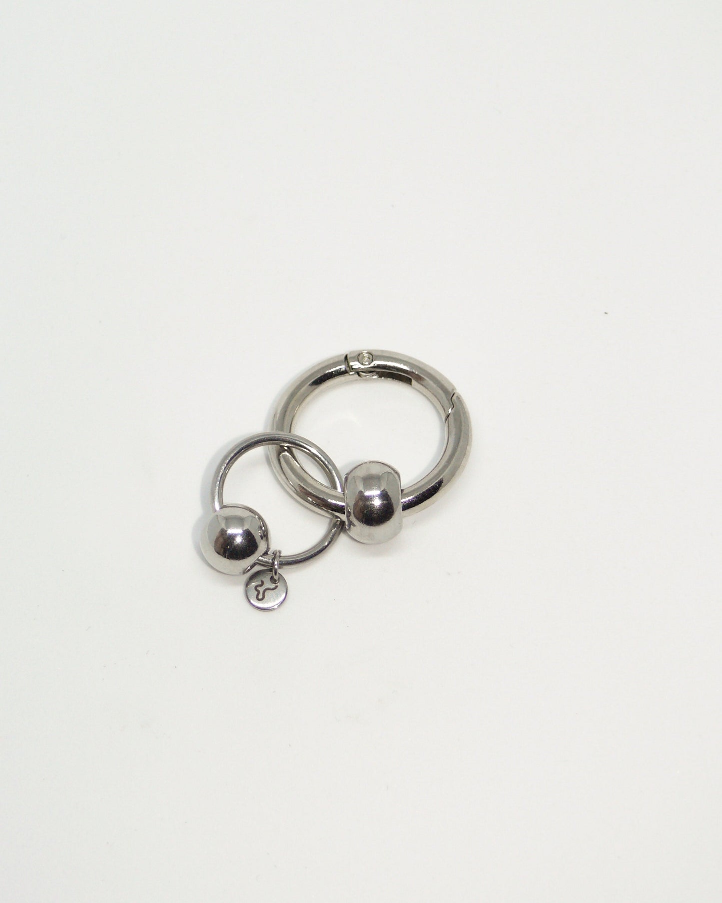 Full steel captive piercing style charm still portrait