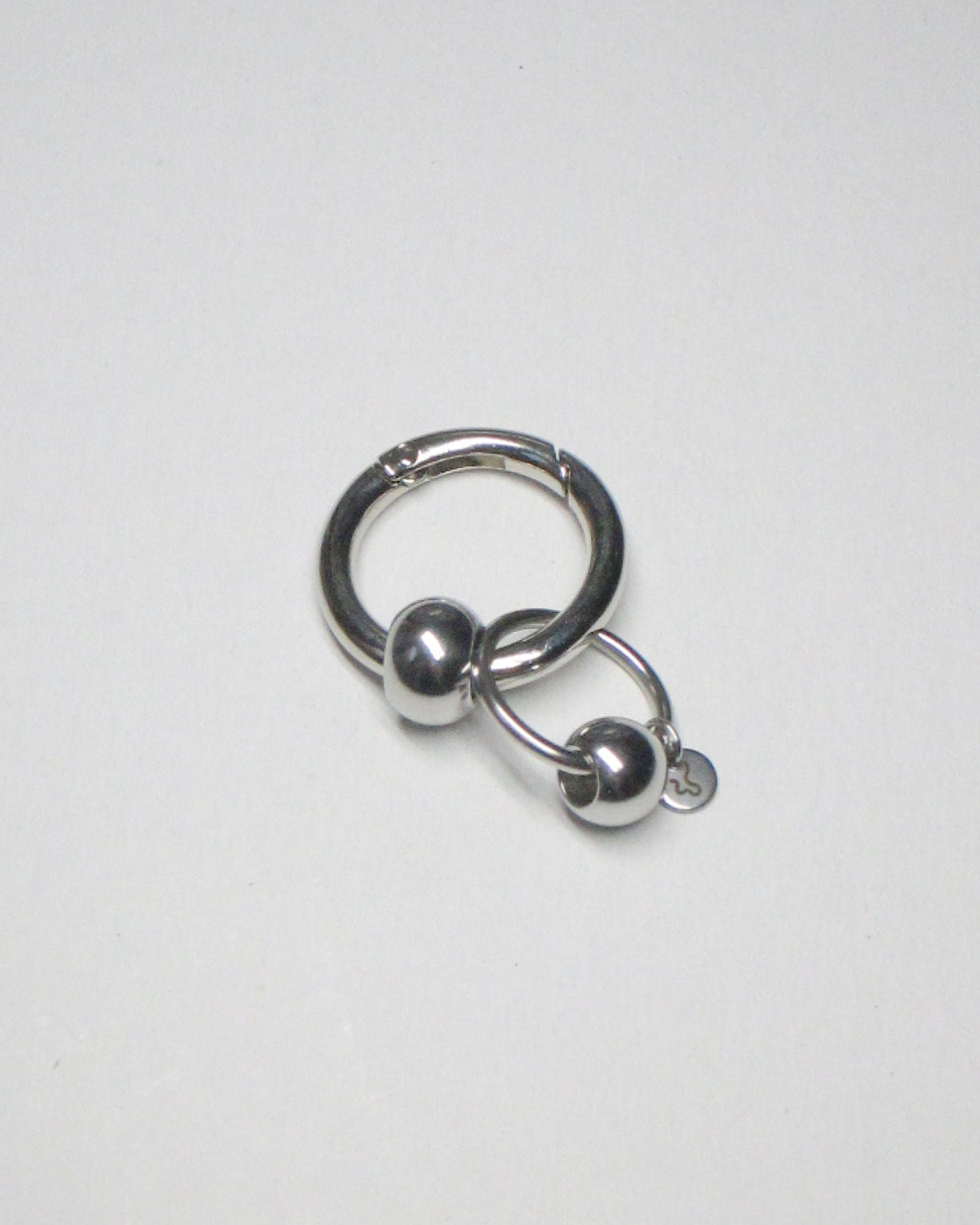 Full steel captive piercing style charm still portrait