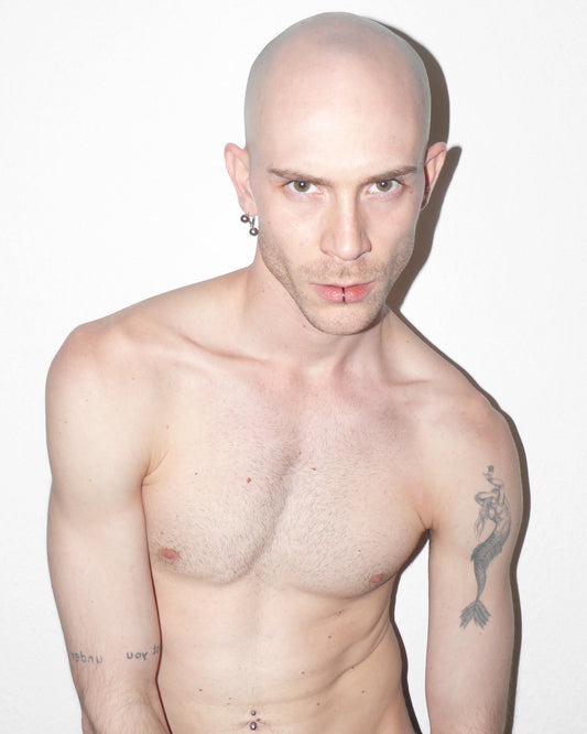 Man with tattoos on a white background