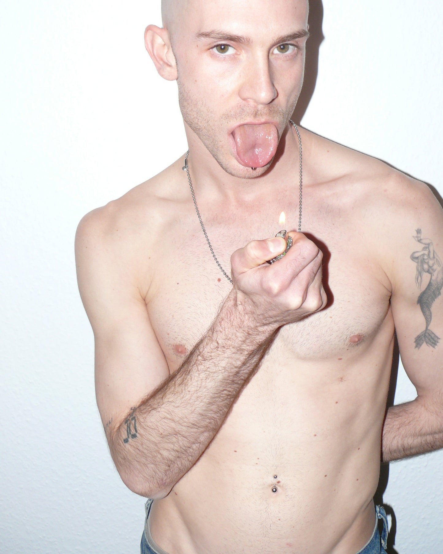 Metal mesh lighter case casted in transparent resin with chain close up on model lighting up tongue out