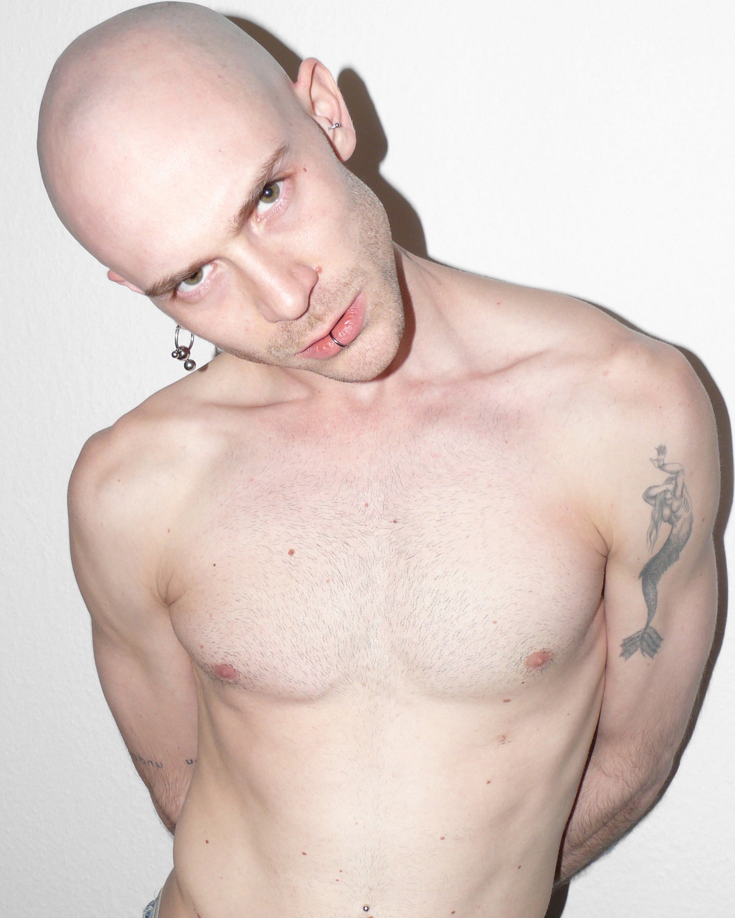 Model with reclined head wearing earring