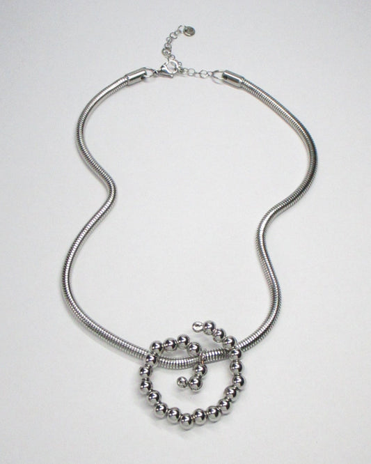 Steel beaded spiral snake chain necklace fluid still portrait