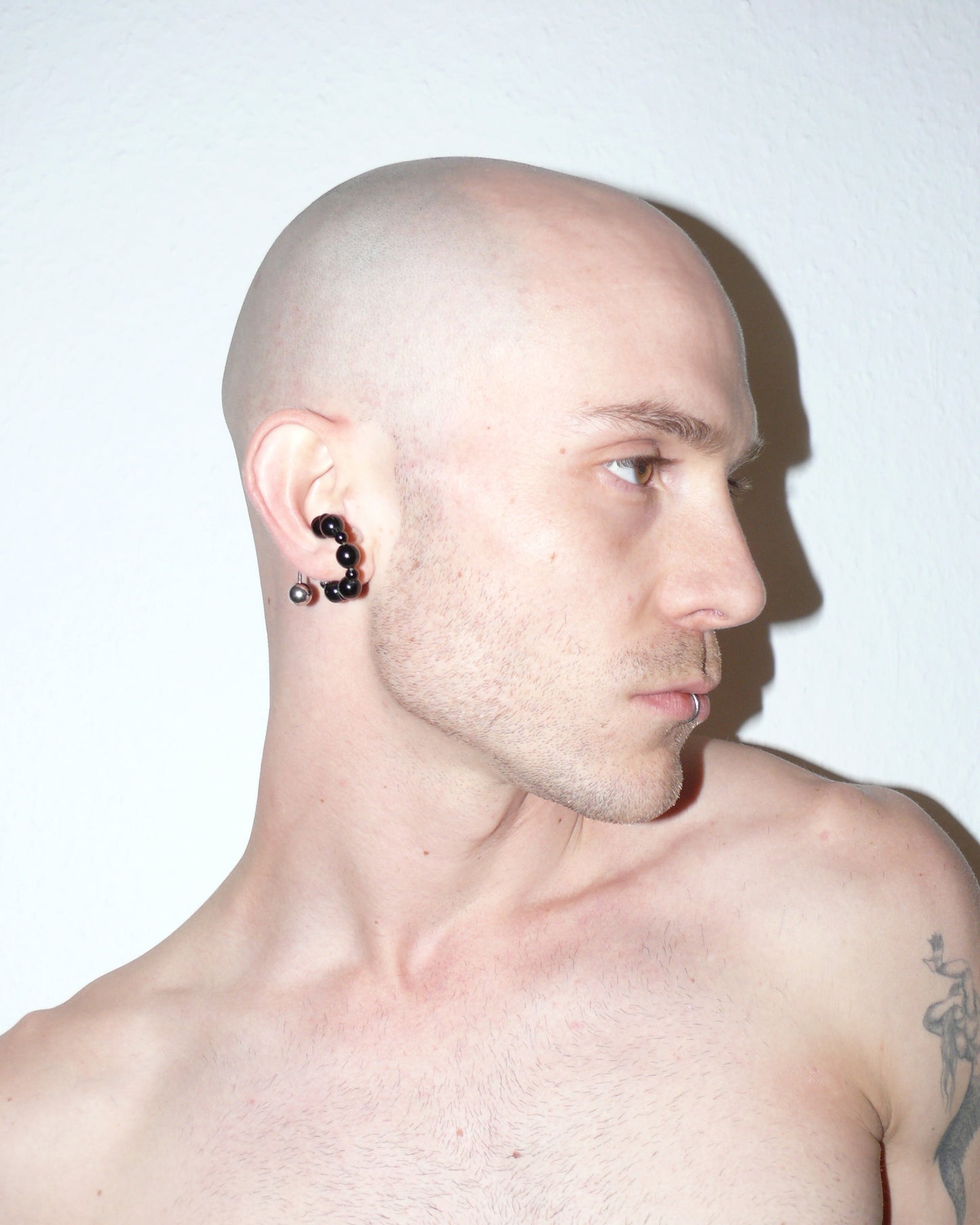 Black agate beads cuff with piercing decoration side portrait on model