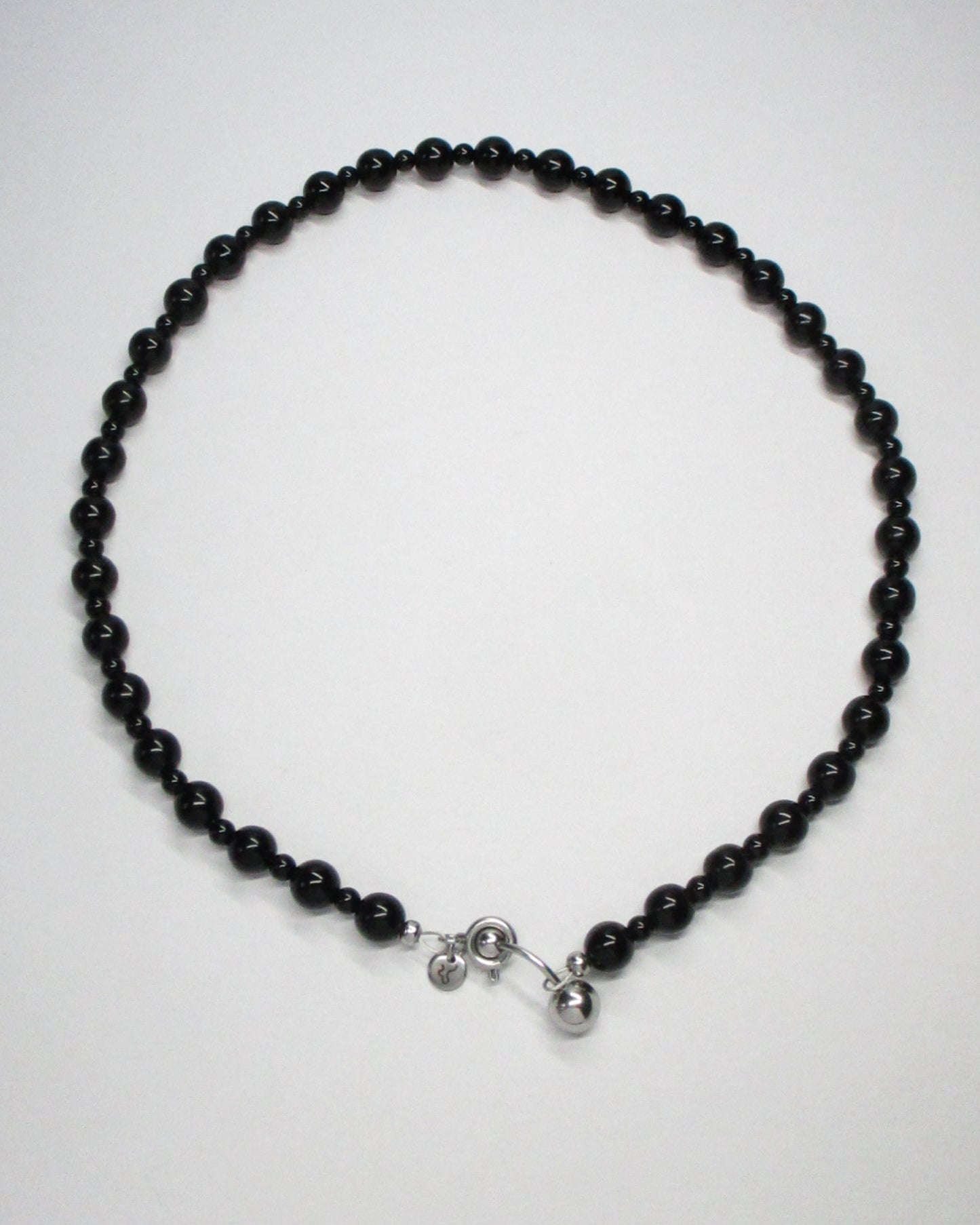 Black agate beads necklace with piercing closure still portrait