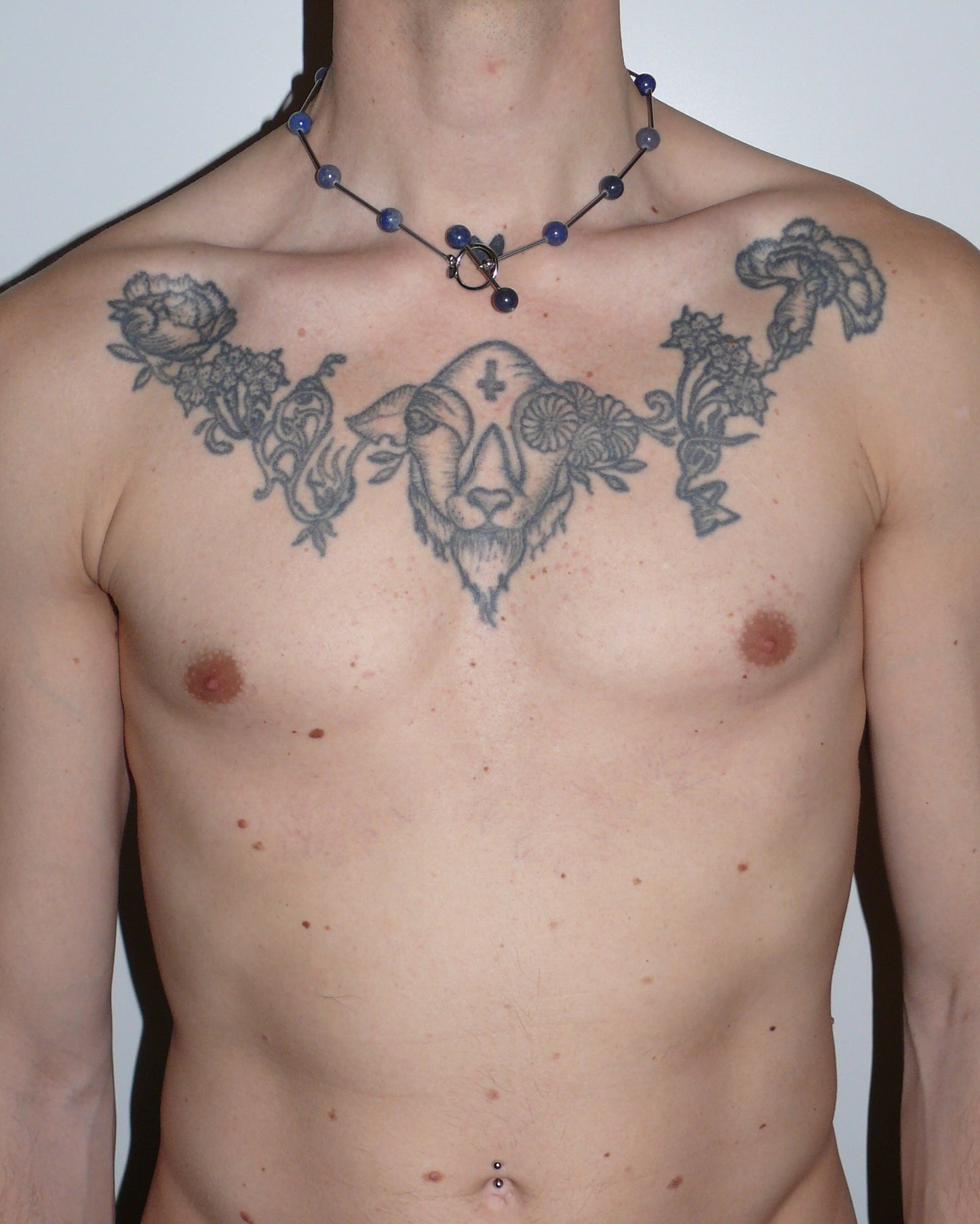 Blue beaded necklace representing water signs portrait on model