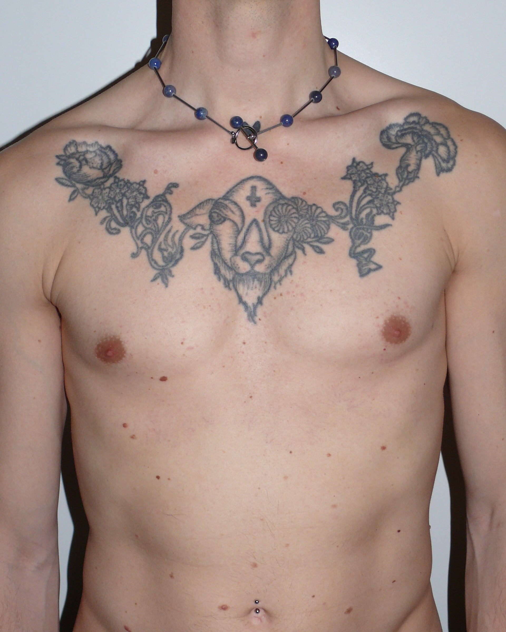 Blue beaded necklace representing water signs portrait on model