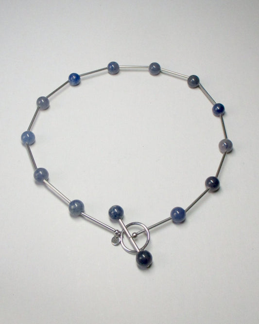 Blue beaded necklace representing water signs