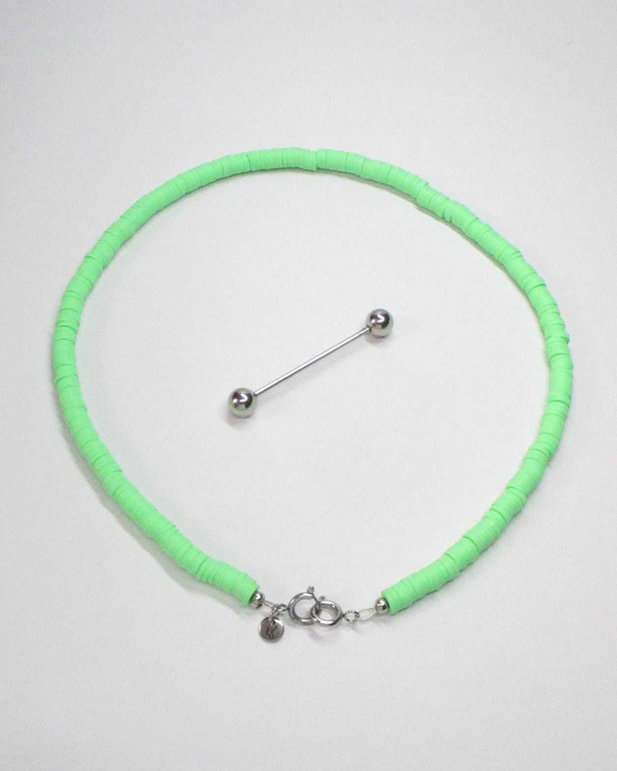 Brat green resin chips necklace with detatched steel barbell closure still portrait