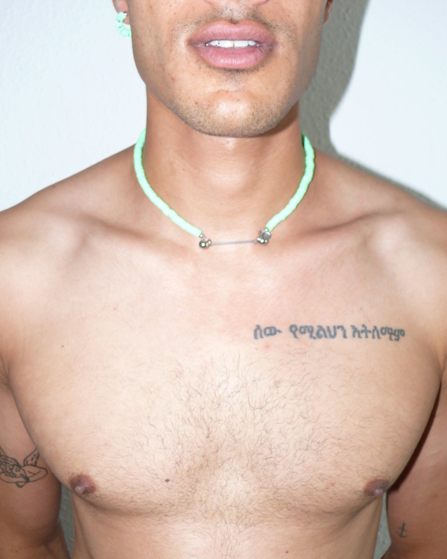 Brat green resin chips necklace with steel barbell closure close-up on model