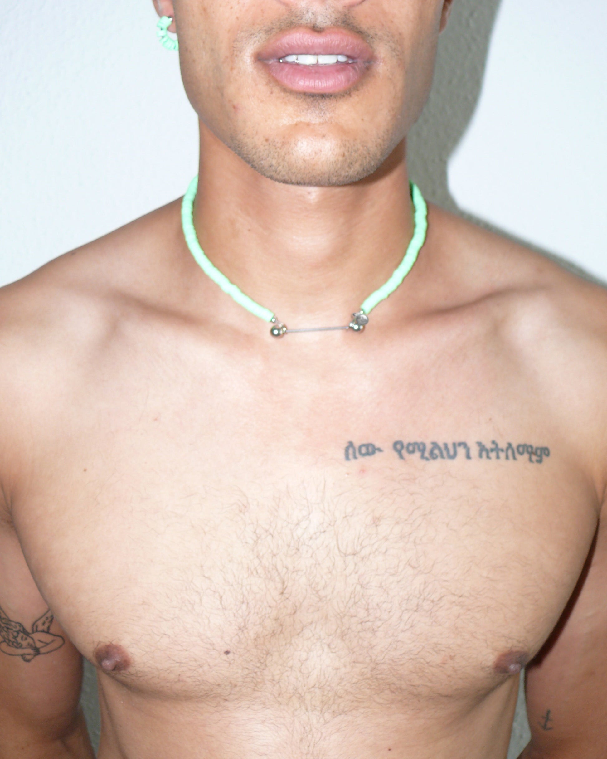 Brat green resin chips necklace with steel barbell closure close-up on model