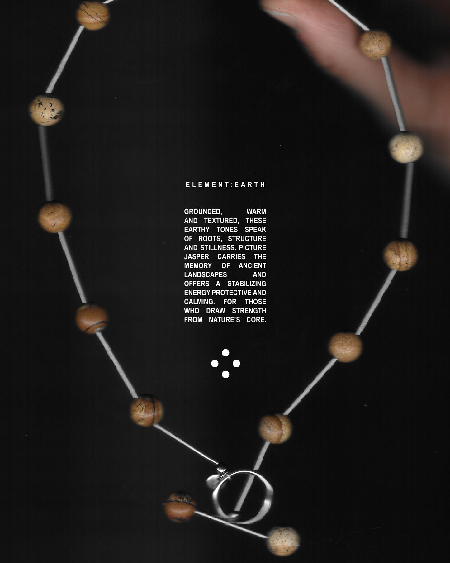 Brown beaded necklace representing earth signs scan