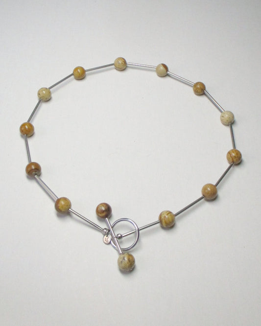 Brown beaded necklace representing earth signs