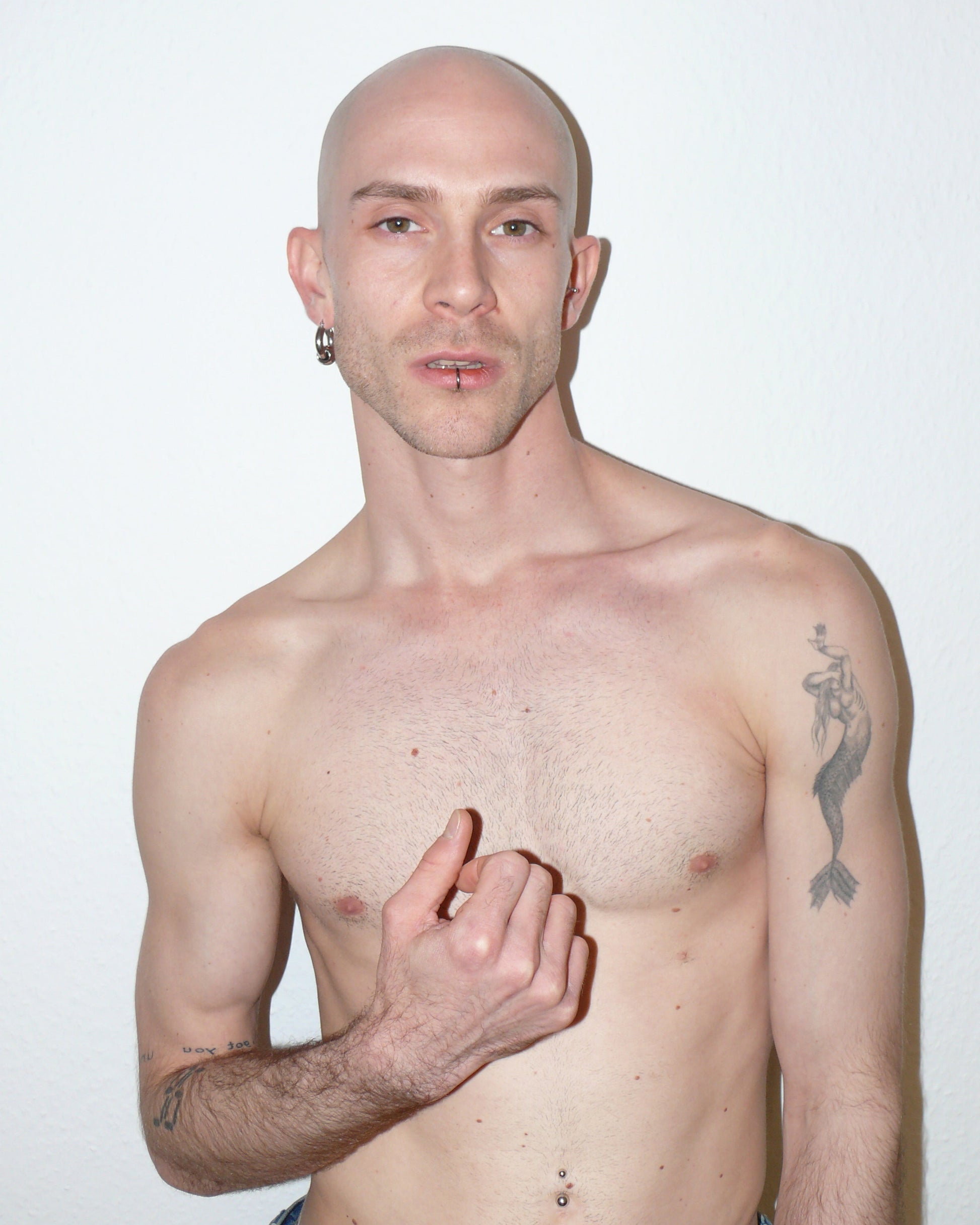 Captive style piercing steel hoops earrings portrait on model