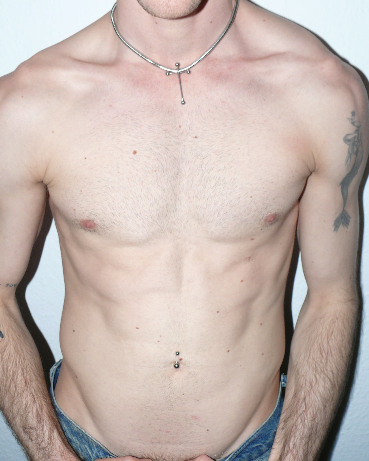 Cross shaped barbells pendant snake steel necklace portrait on model torso