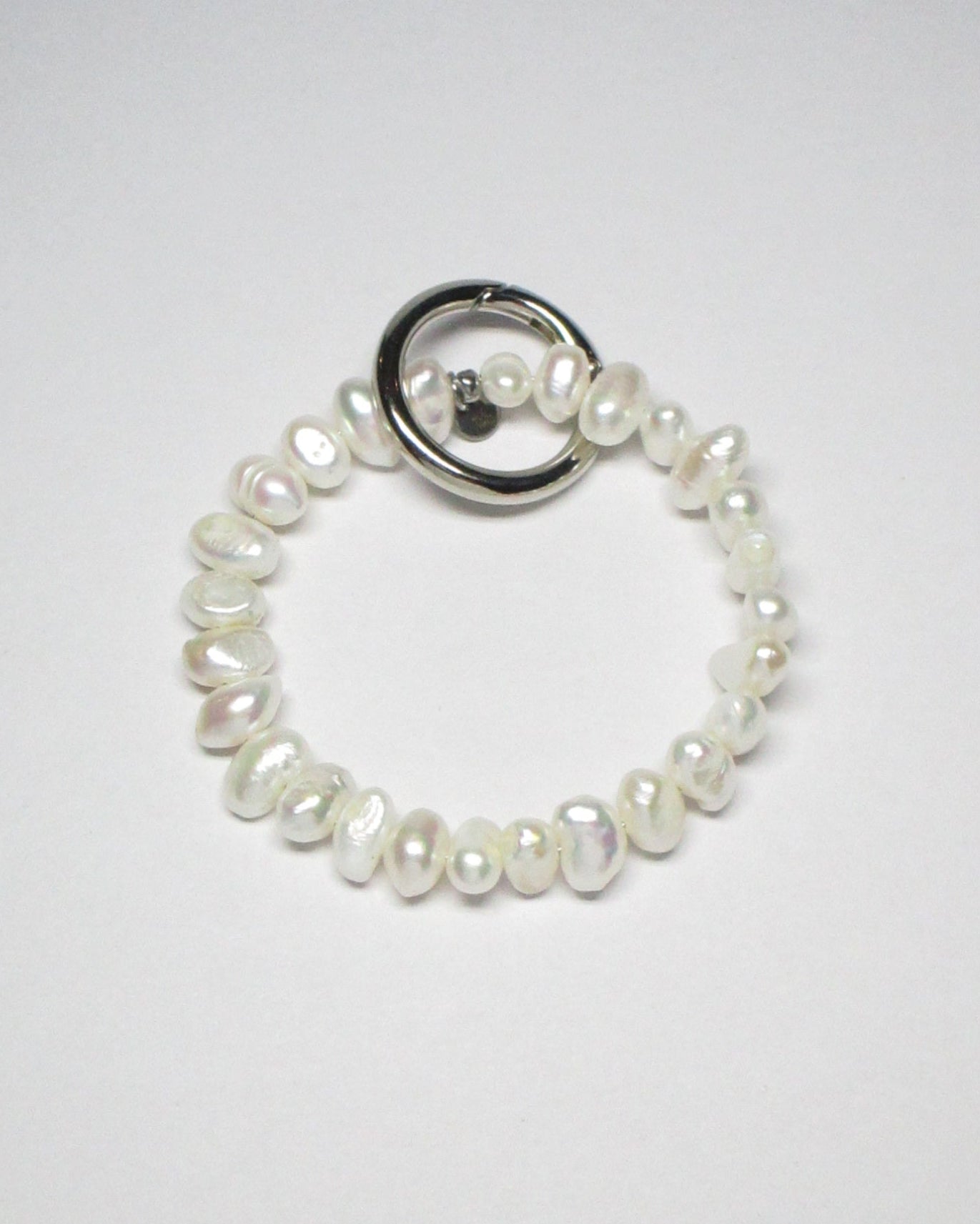 Freshwater pearls key and cock ring still portrait