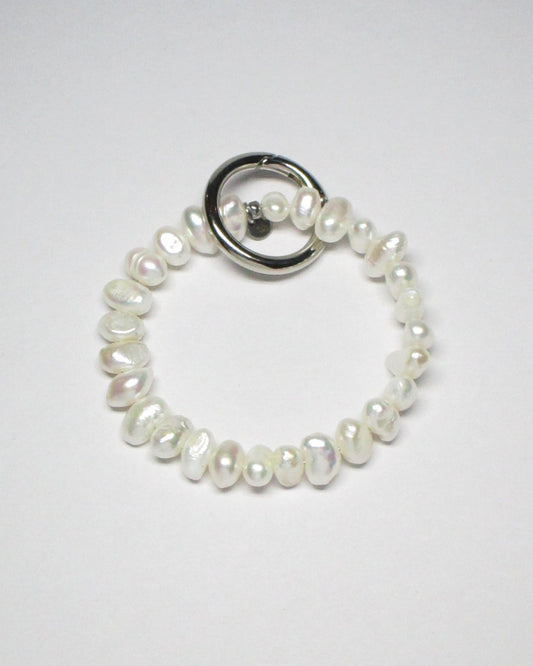 Freshwater pearls key and cock ring still portrait