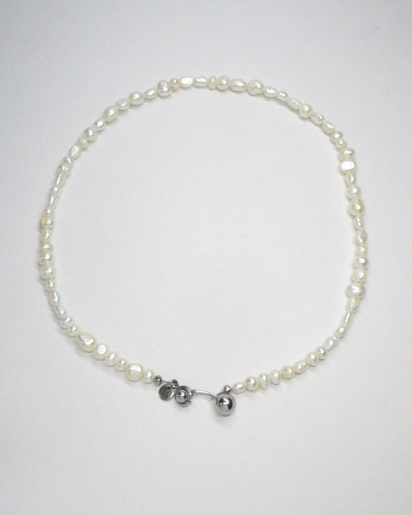 Freshwater pearls necklace with piercing closure still portrait
