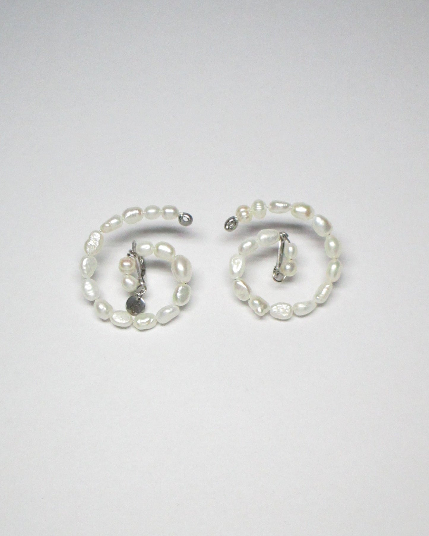 Freshwater pearls spiral button earrings still portrait