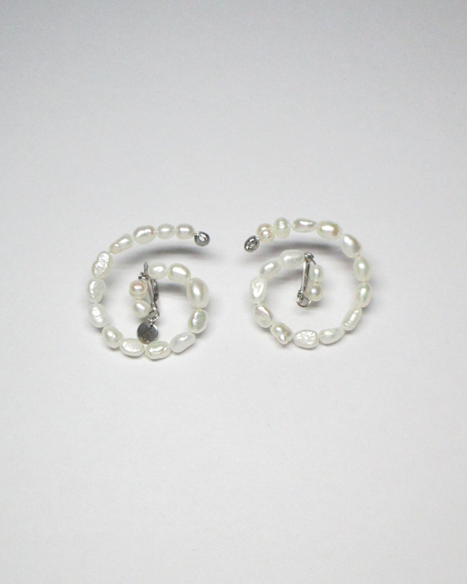 Freshwater pearls spiral button earrings still portrait