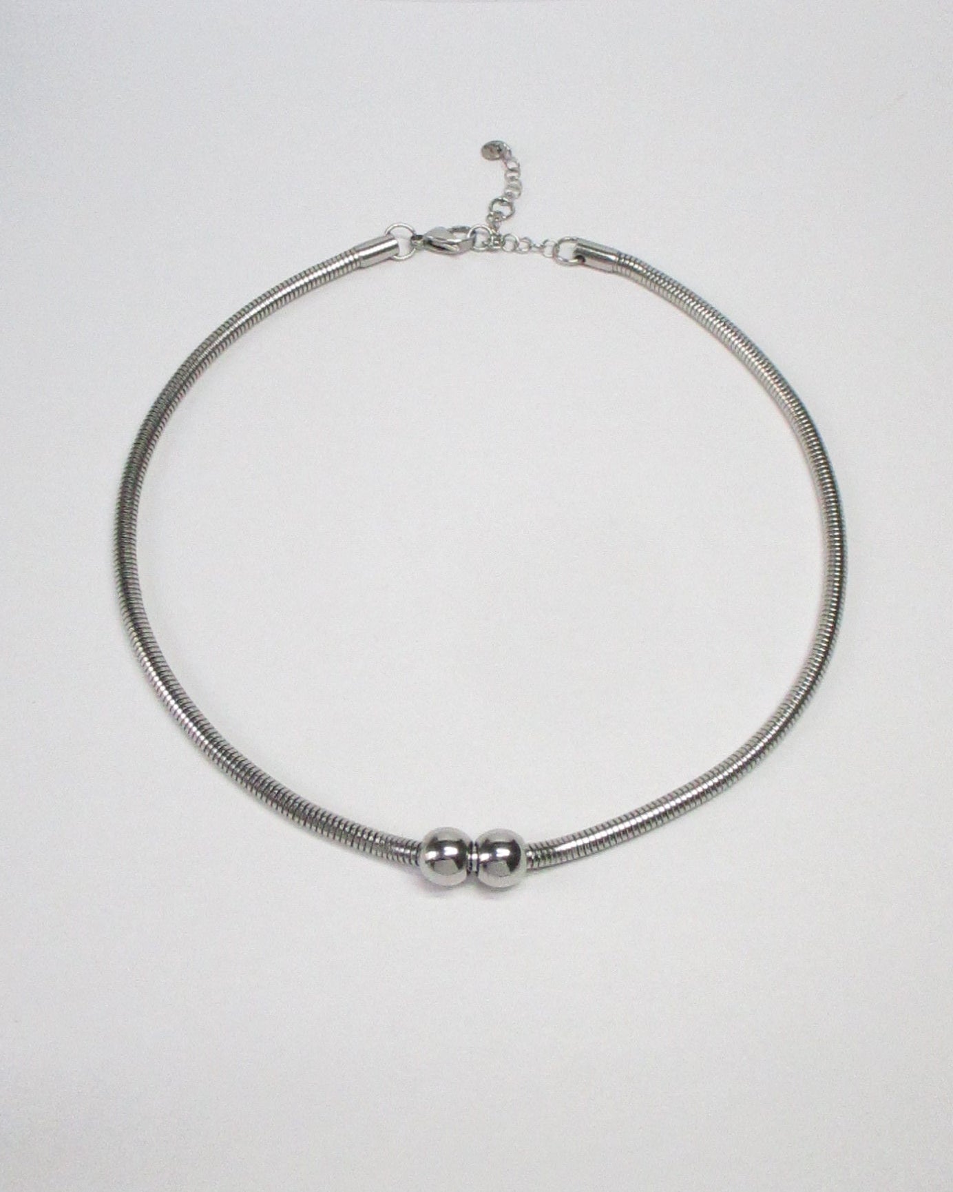 Gemini boulles steel necklace still portrait