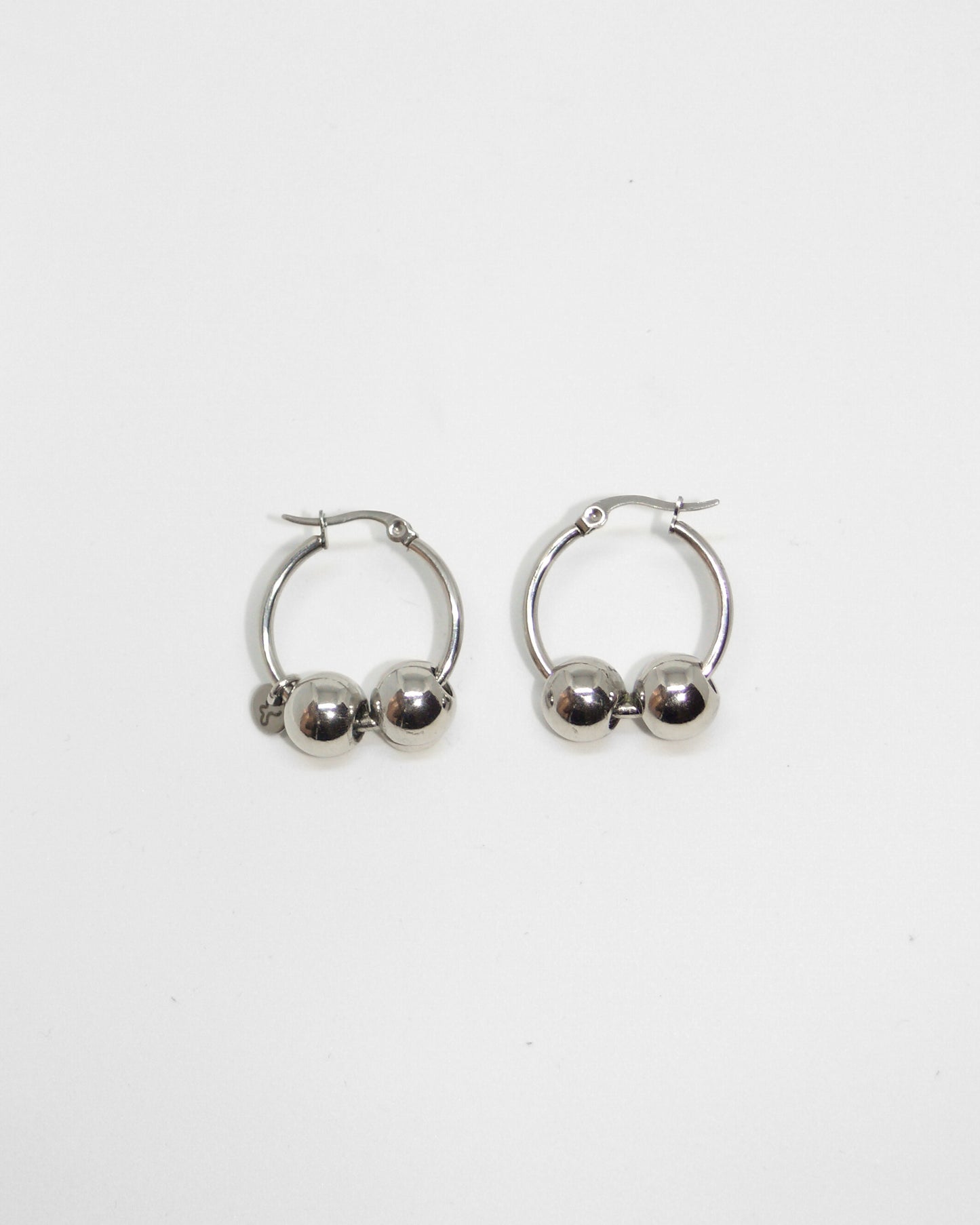 Gemini boulles steel earrings still portrait