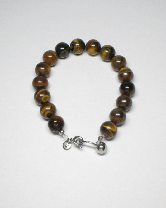 Gemstone tigereye agate bracelet with piercing closure still portrait