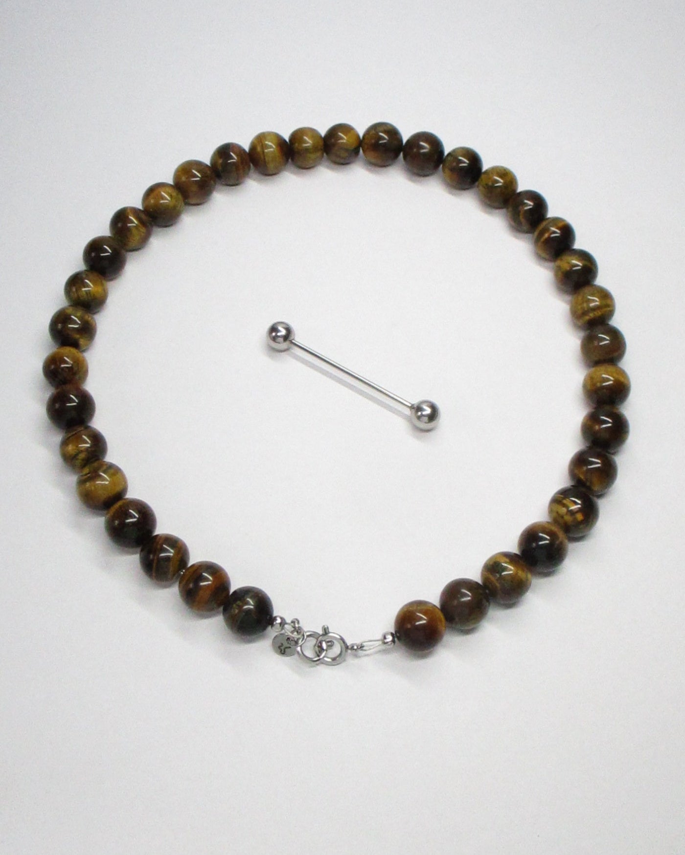 Gemstone tiger eye agate necklace with piercing closure detatched still portrait