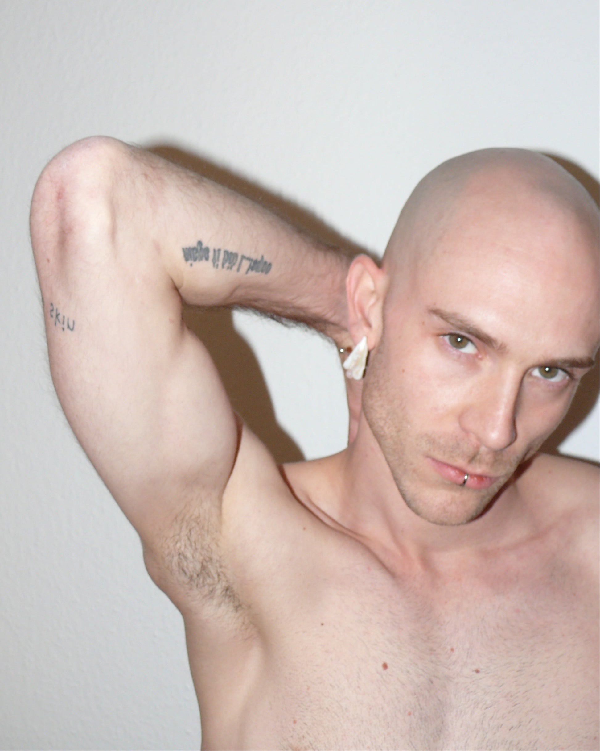 Ghost shaped freshwater pearl earrings with piercing decoration portrait on model