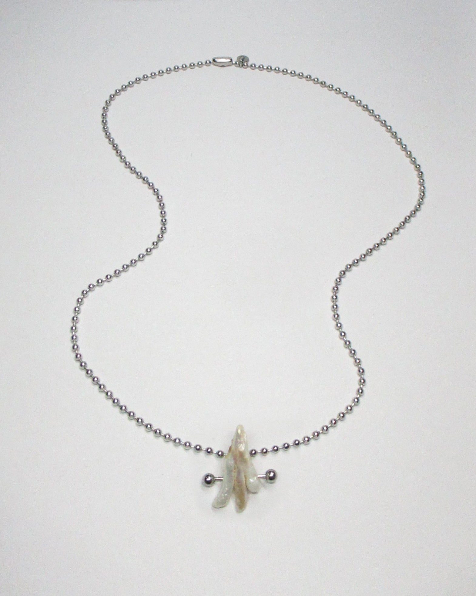 Ghost shaped freshwater pearl pendant necklace still portrait