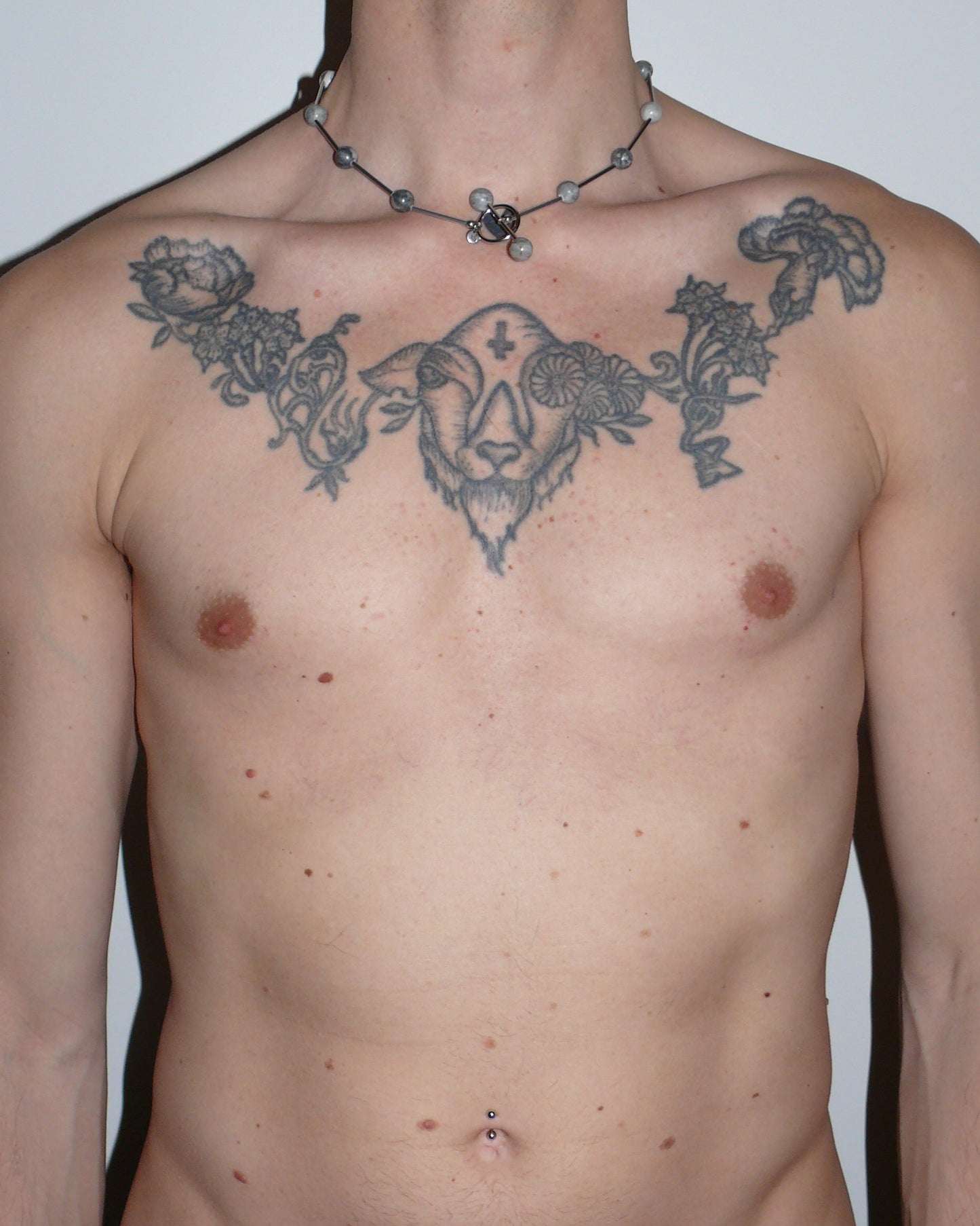 Gray beaded necklace representing air signs portrait on model