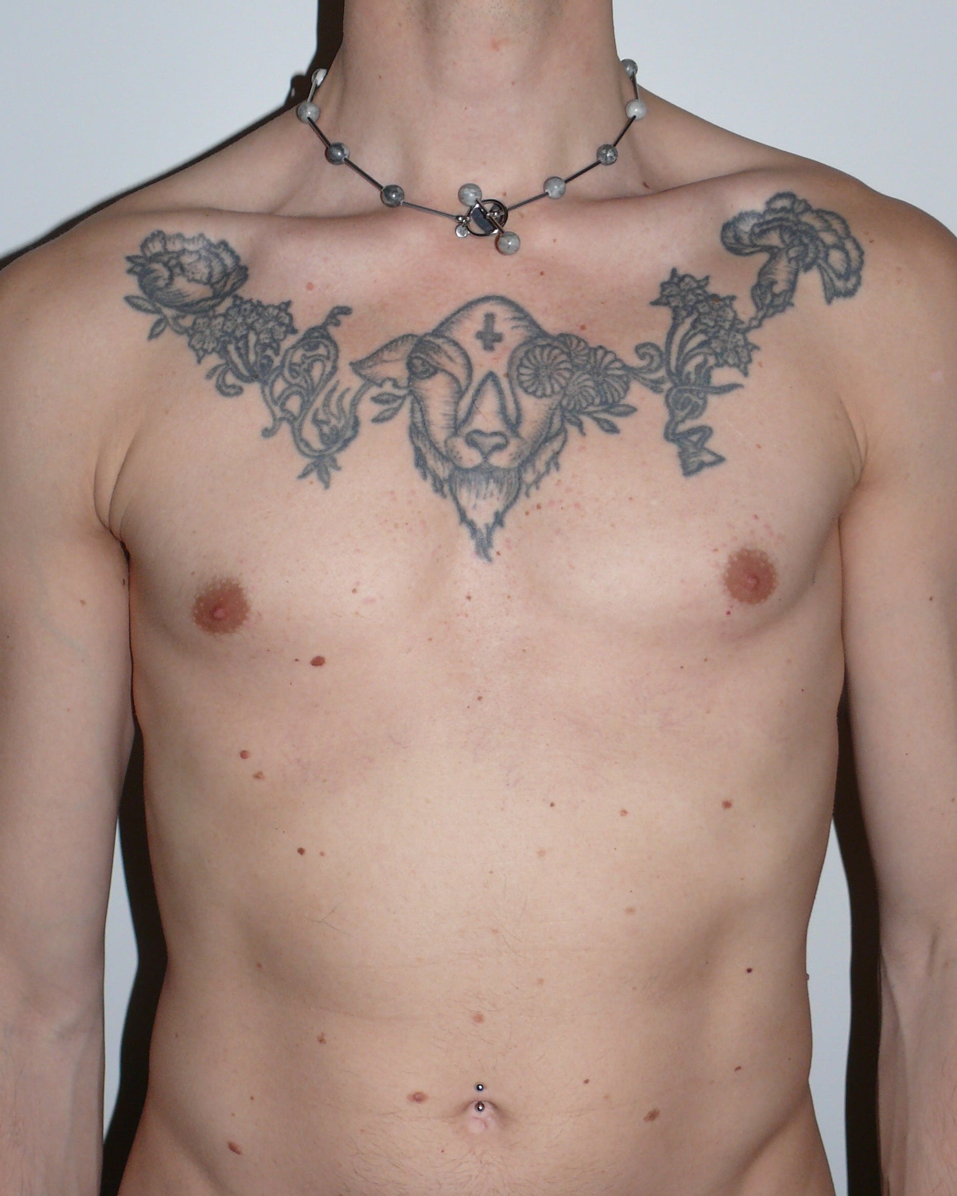 Gray beaded necklace representing air signs portrait on model