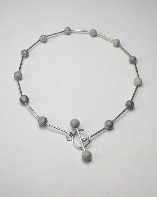 Grey beaded necklace representing air signs