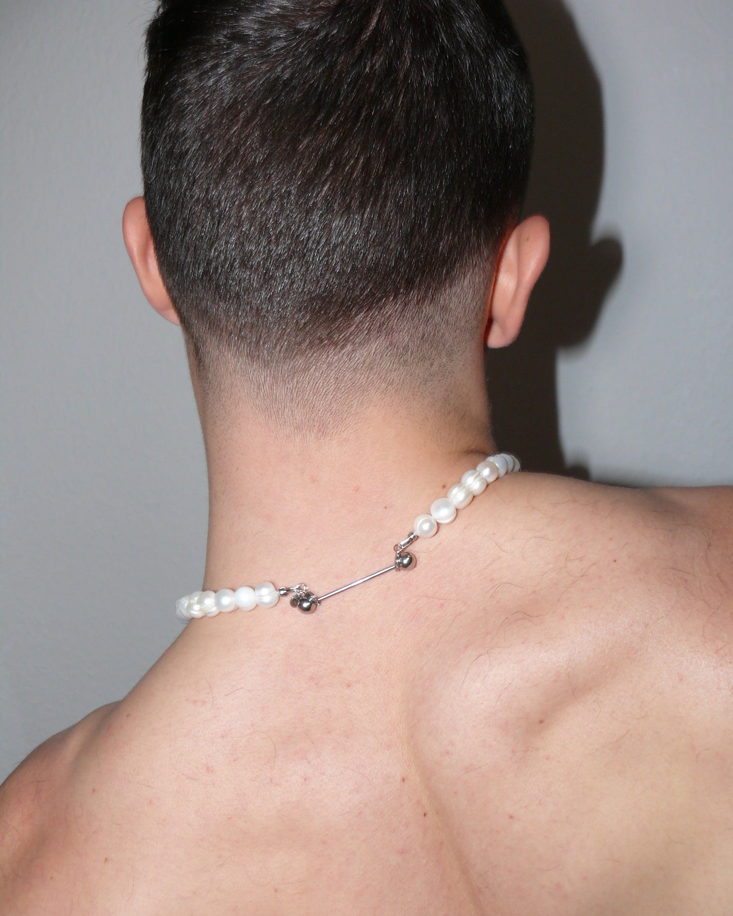 Legacy pearly necklace worn back