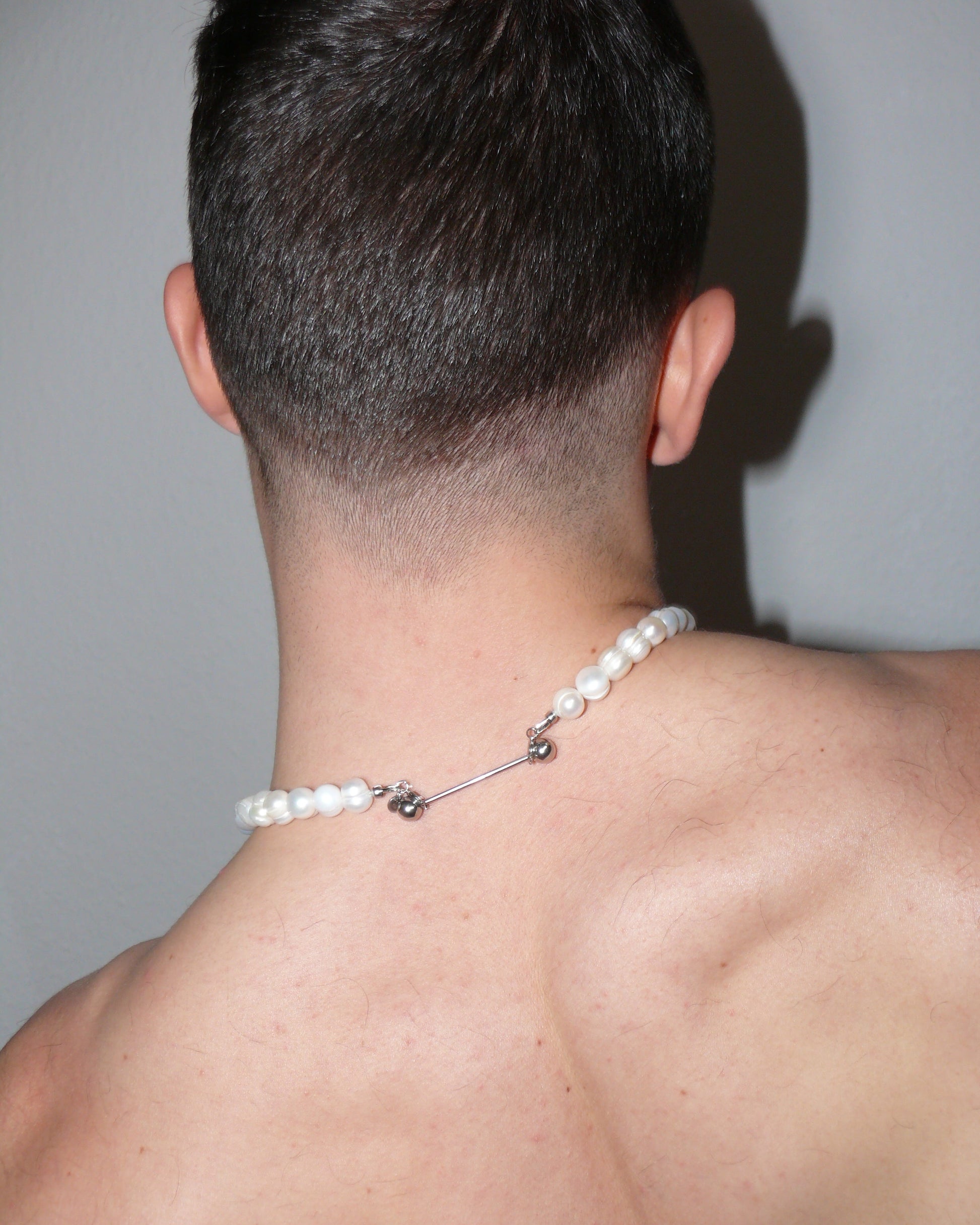 Legacy pearly necklace worn back