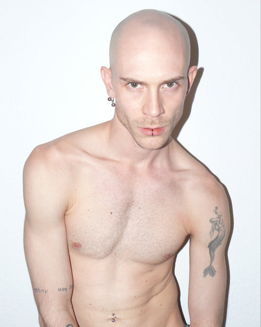 Man with tattoos on a white background