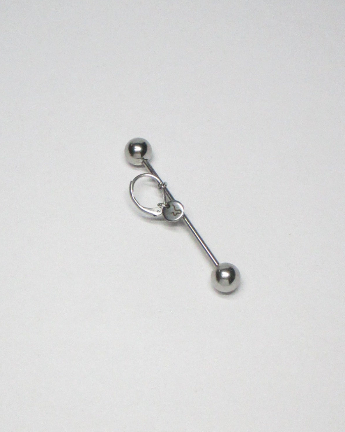 Maxi barbell piercing single earring still portrait