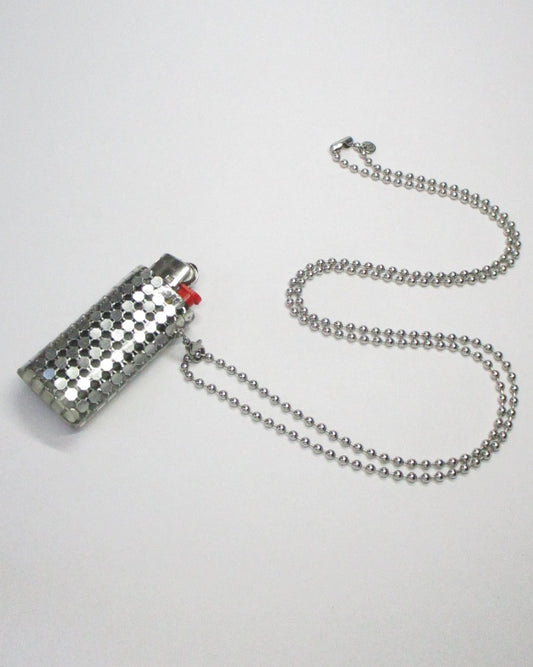 Metallic lighter with a chain on a white background