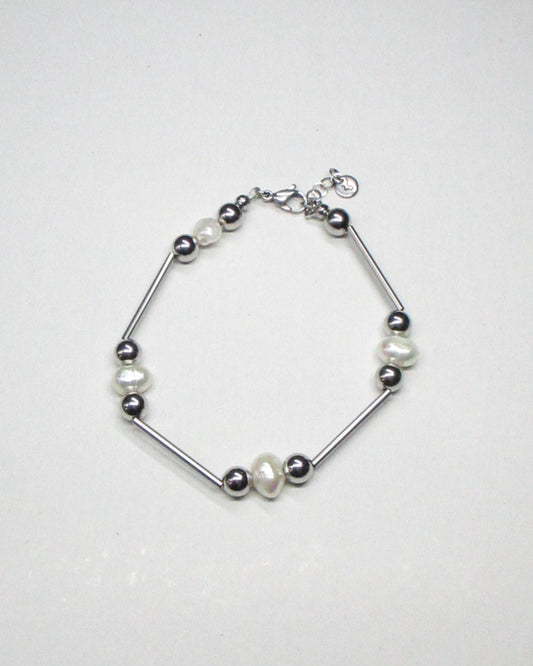 Mille barbells steel and freshwater pearls bracelet still portrait
