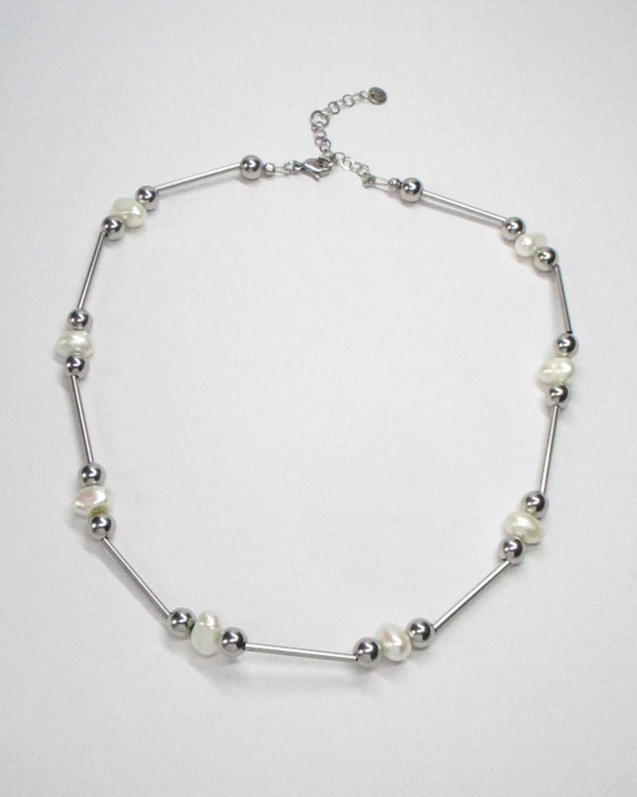 Mille barbells steel and freshwater pearls necklace still portrait