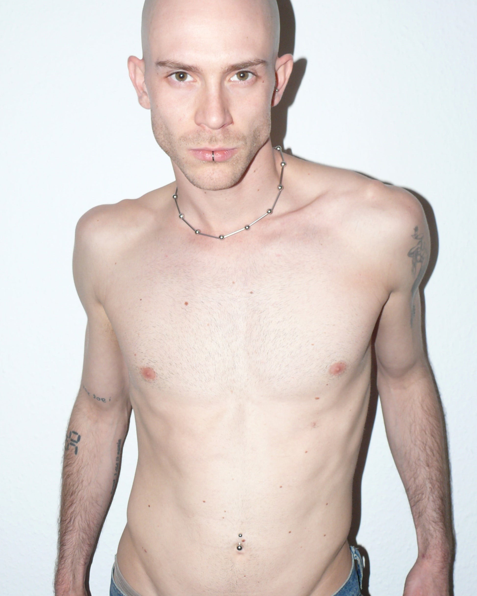 Mille barbells steel necklace frontal portrait on model with shoulders open