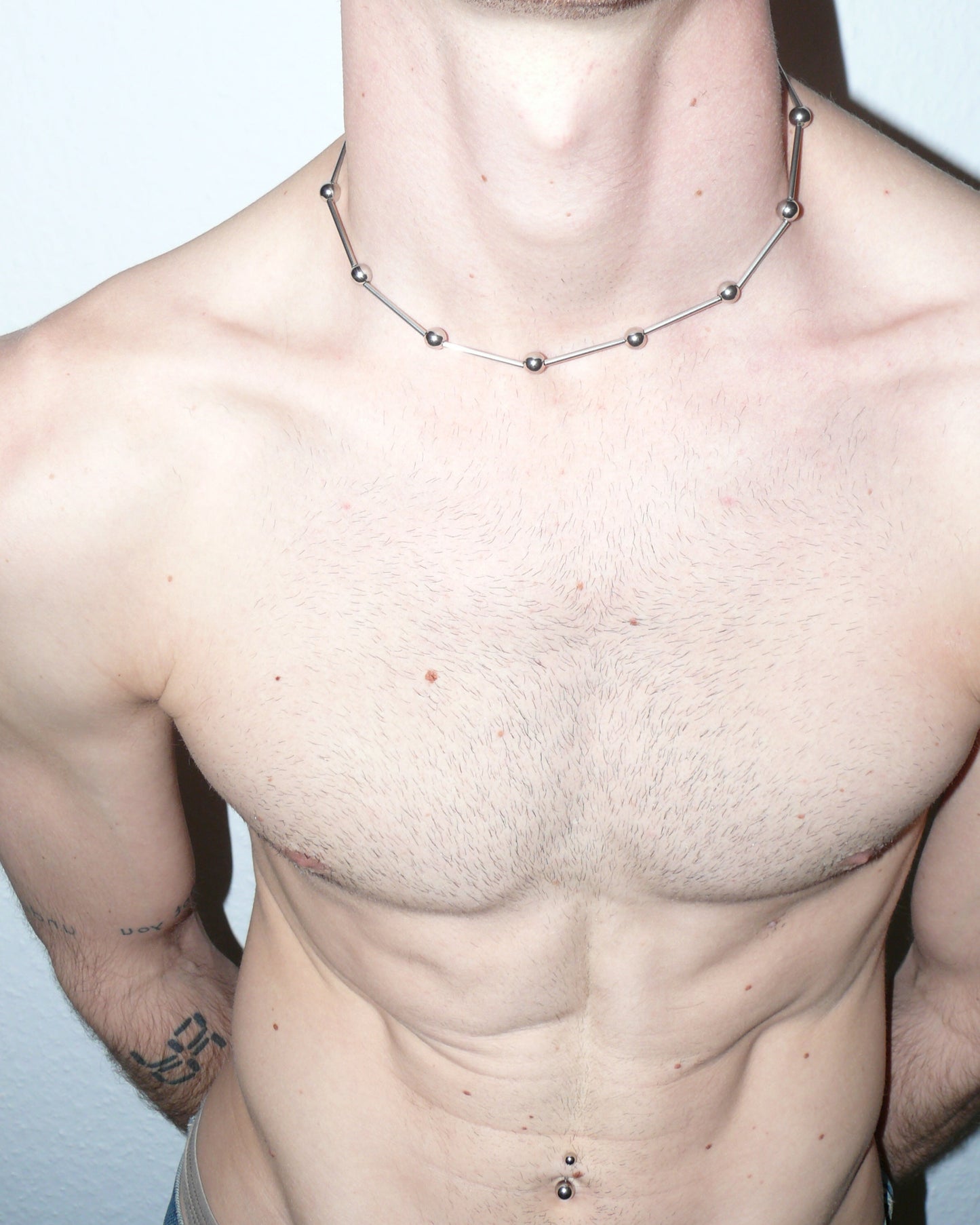 Mille barbells steel necklace top close-up on torso model