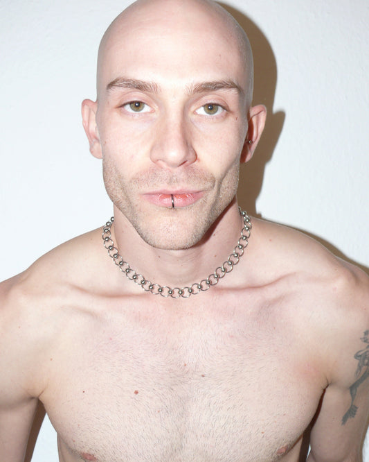 Mille captive style piercing steel necklace frontal close up on model