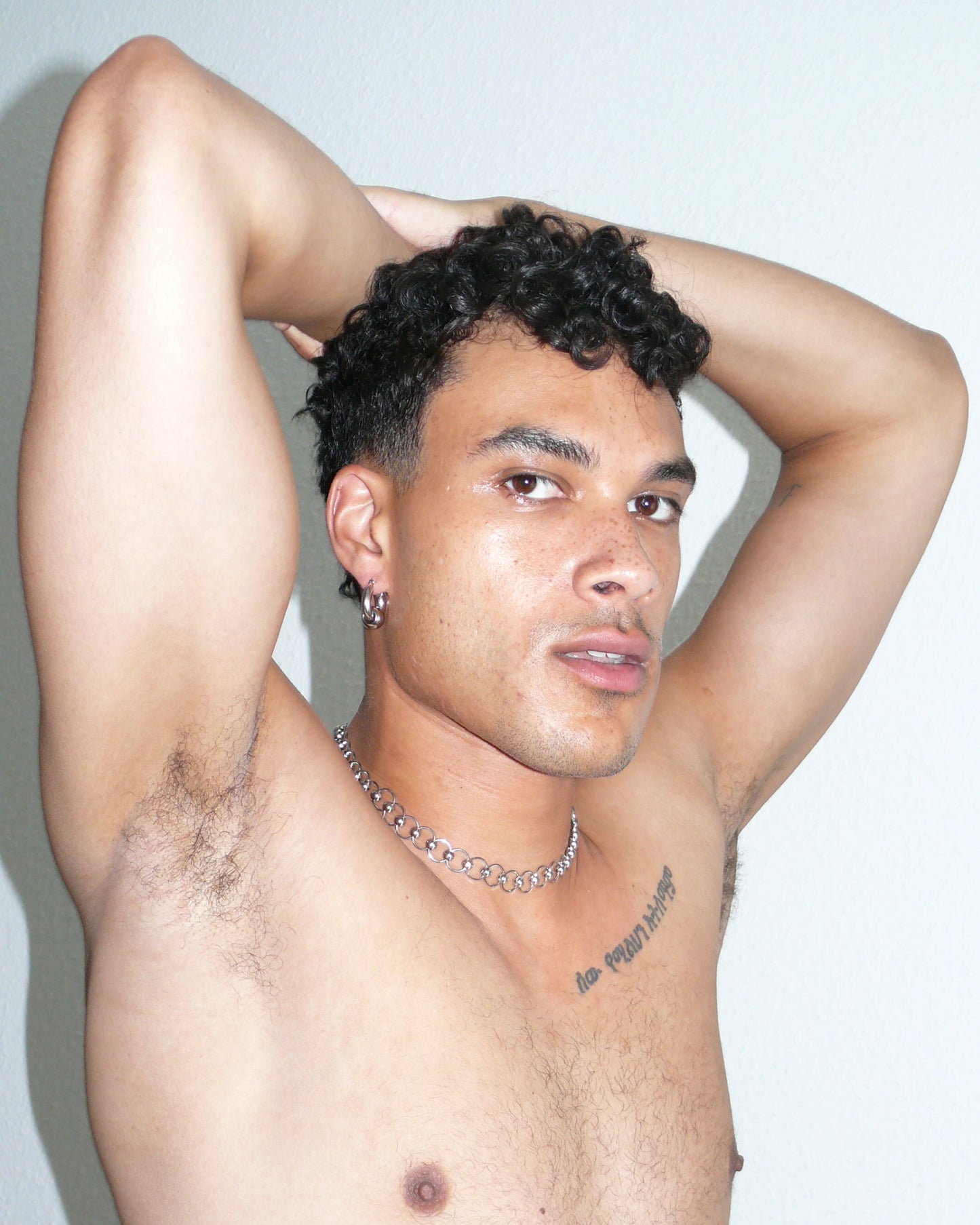 Mille captive style piercing steel necklace side portrait on poc model