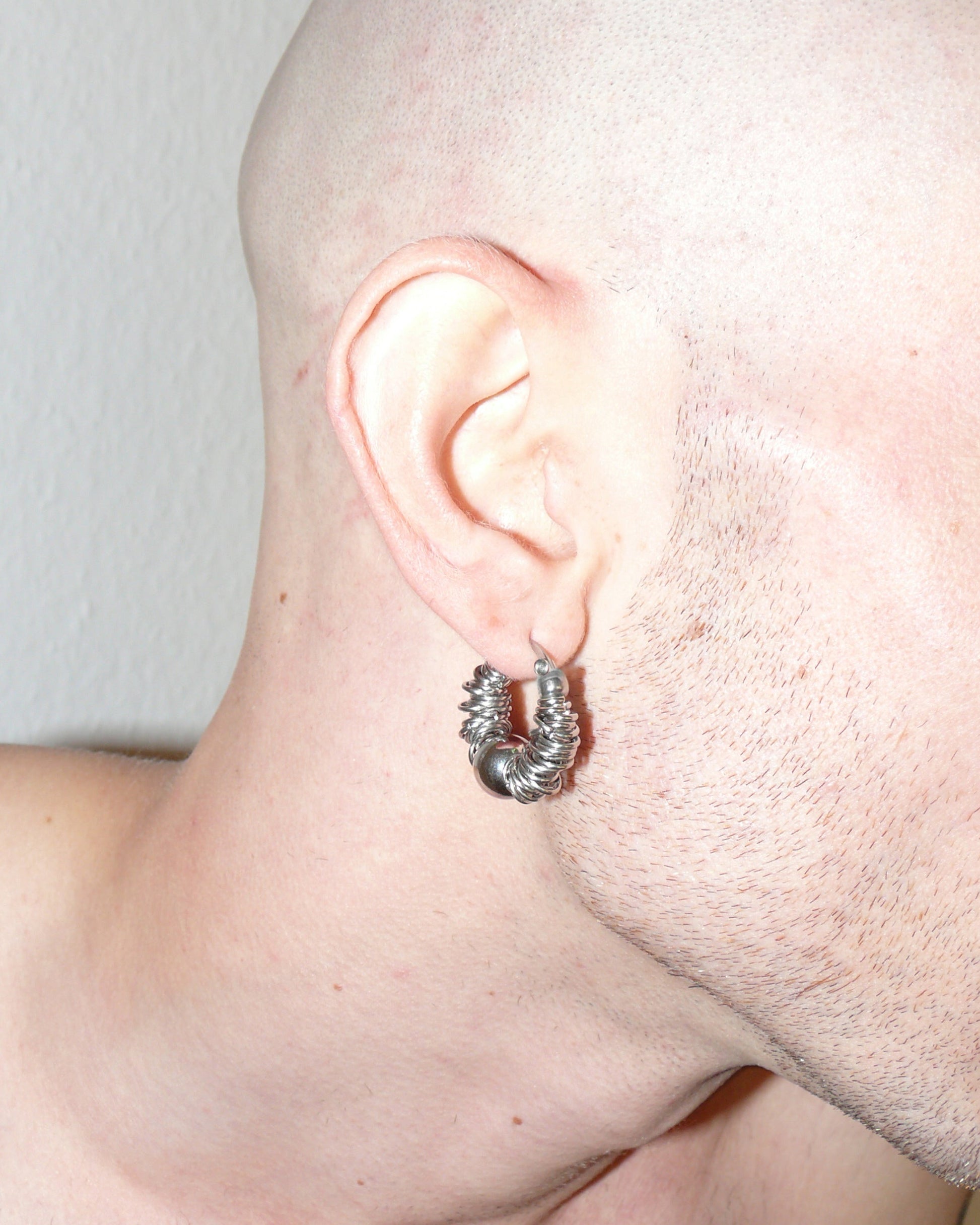 Mille steel rings hoops earrings close-up model