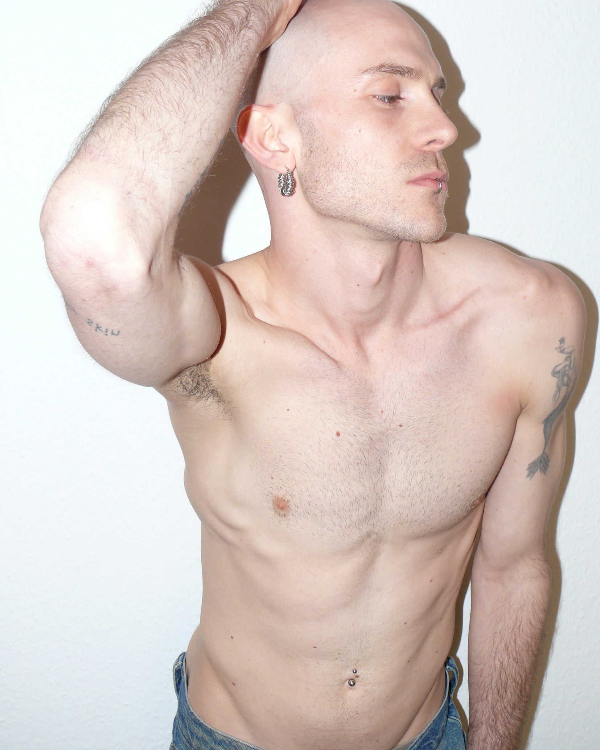 Mille steel rings hoops earrings side portrait model rising arm