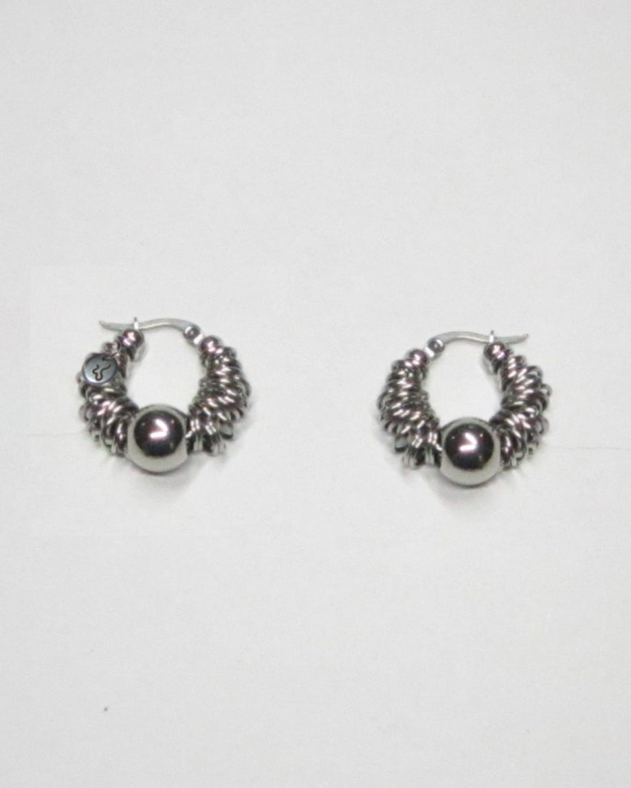 Mille steel rings hoops earrings still portrait