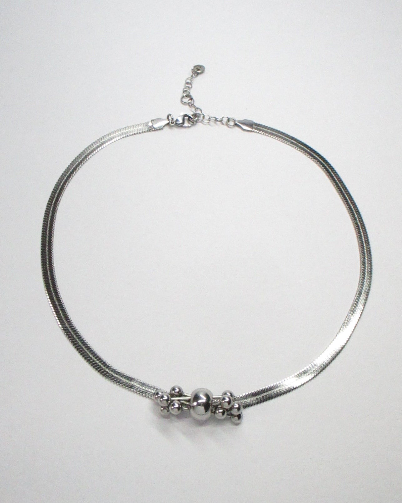 Multiple steel barbells decoration flat snake chain necklace still portrait