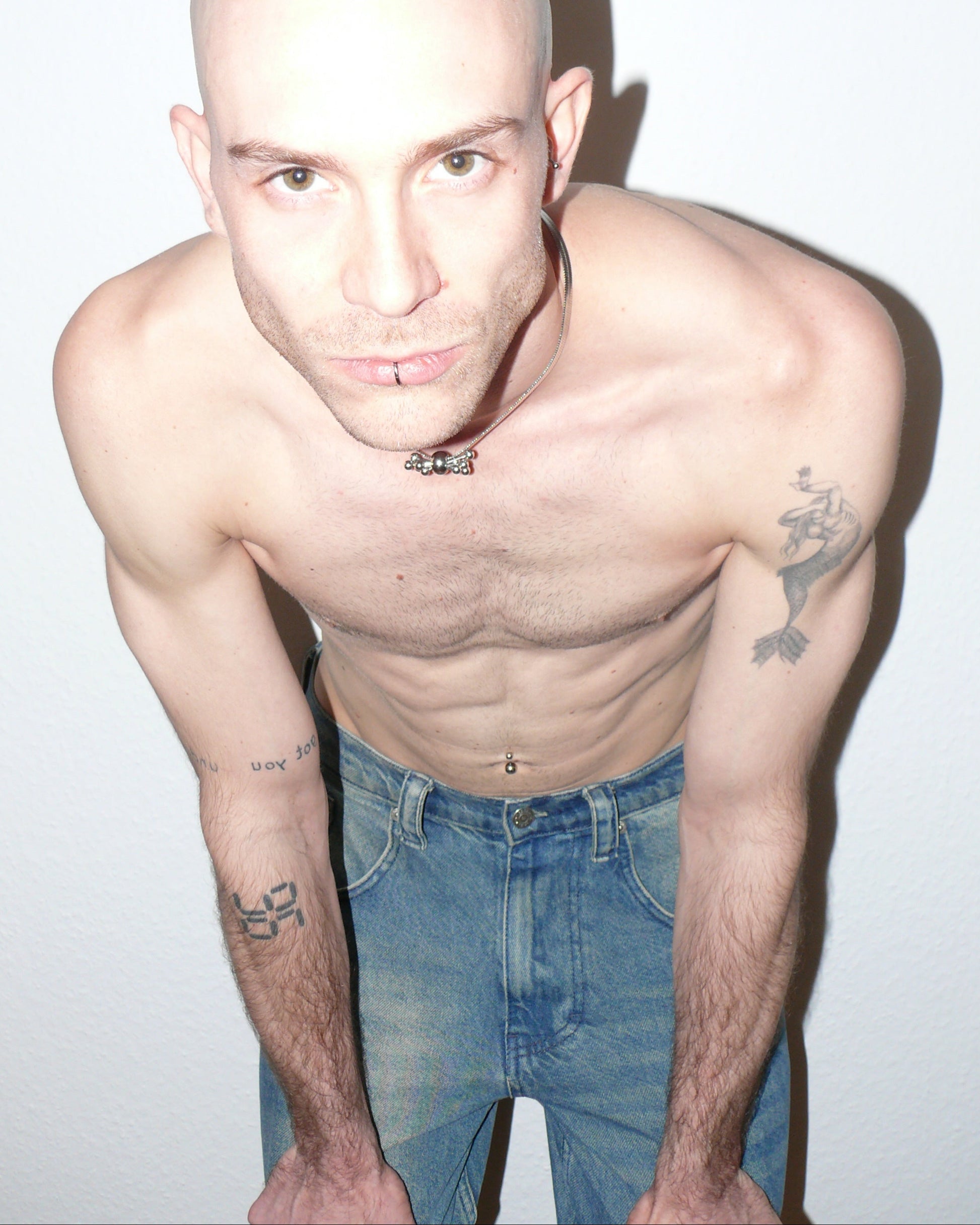 Multiple steel barbells decoration flat snake chain necklace top close-up on bent position model