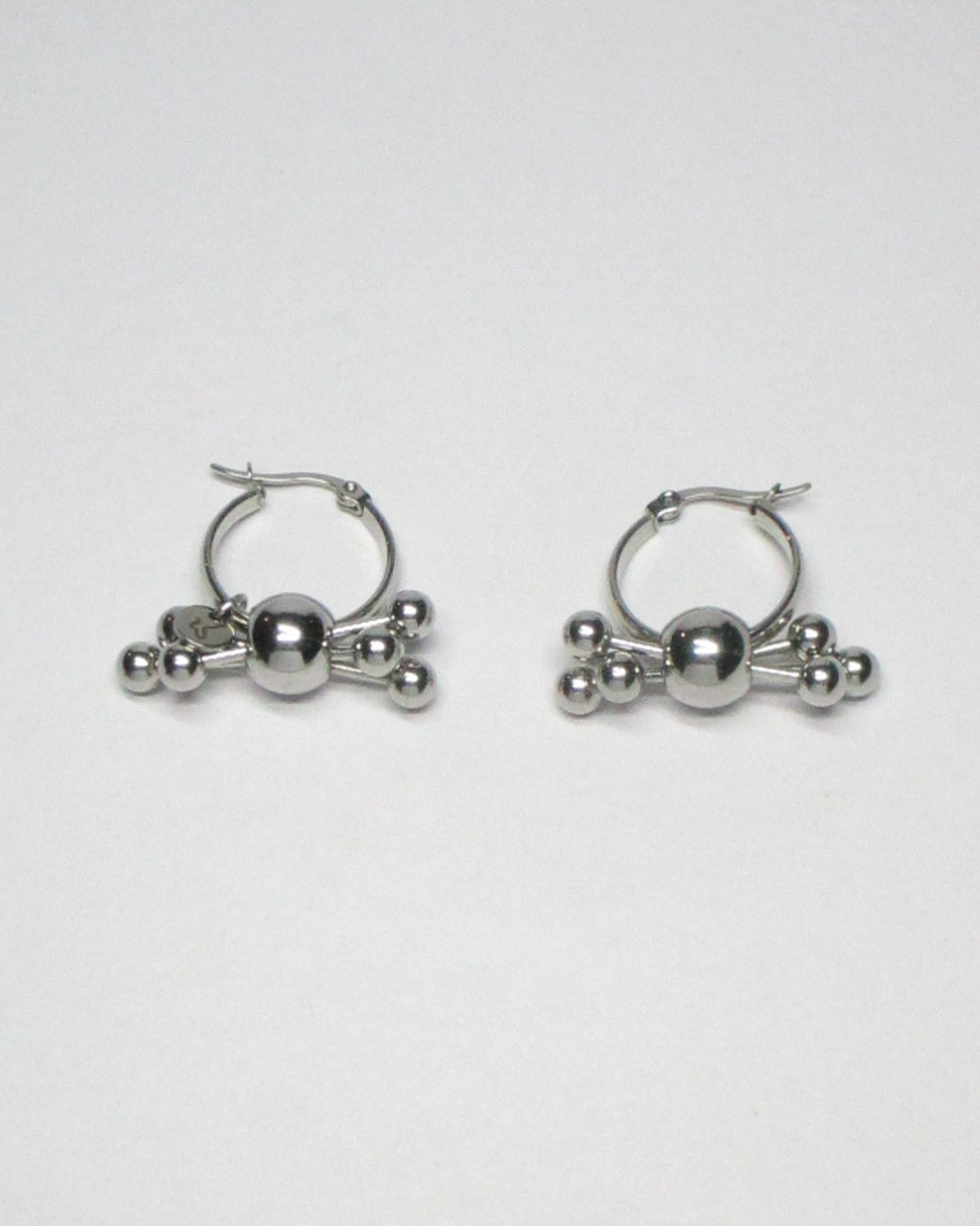 Multiple steel barbells decoration hoop earrings still portrait